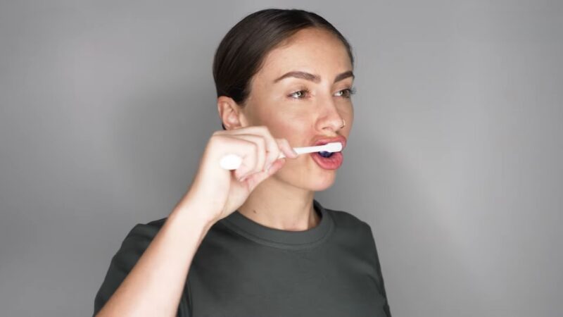 Brushing with Purple Toothpaste